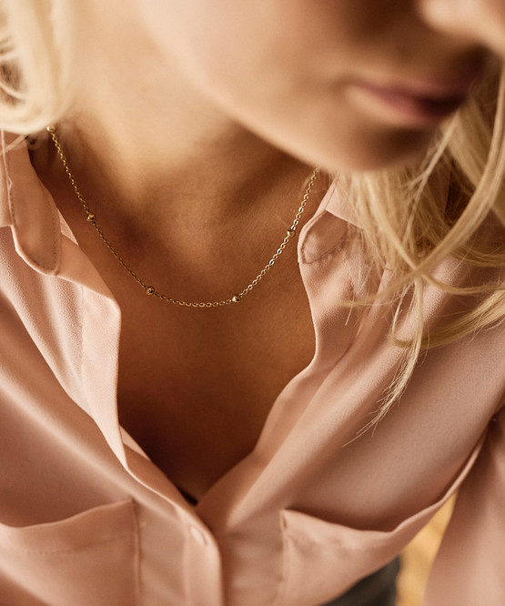 Model wearing Golden Grand Ball Necklace