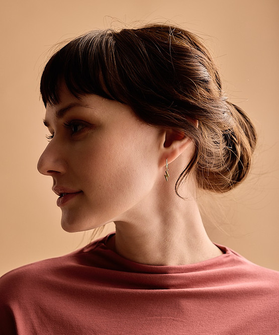 Model Wearing Allergy-Safe Golden Titanium 11mm Pendant Flash Ear Ring