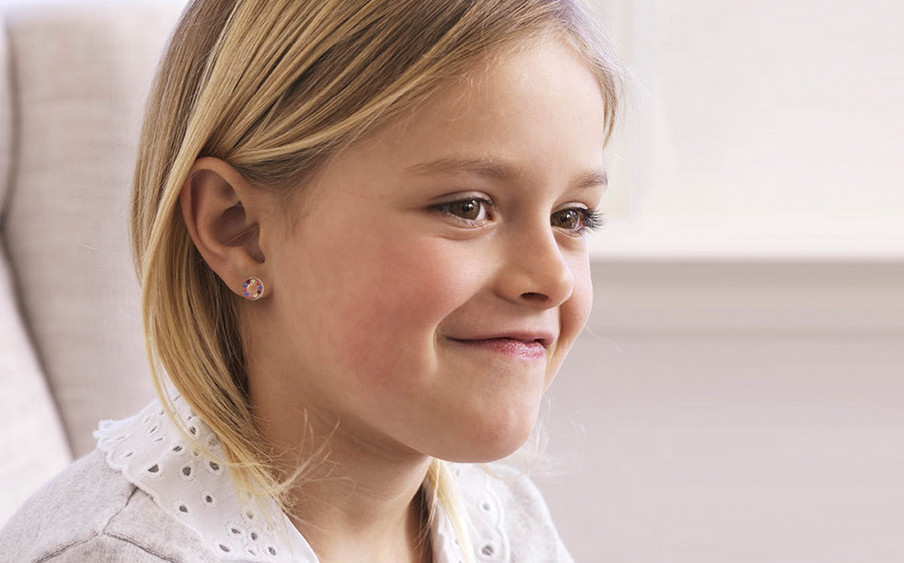 Girl sales wearing earrings