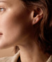 Model wearing 8mm Golden Titanium Plain Cross Earrings