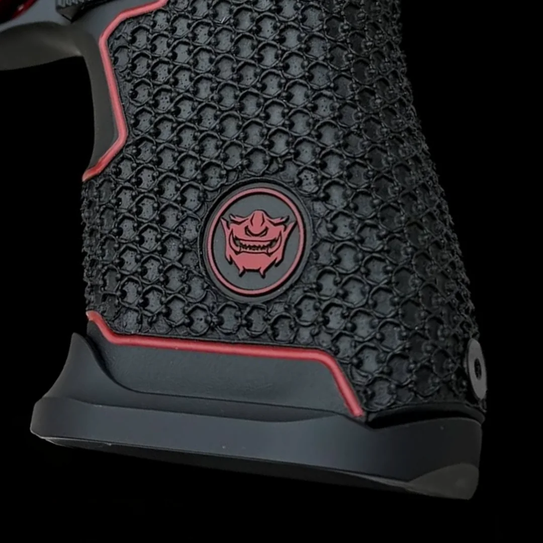Present-day Shogun work: stippled grip with a red color-filled border and a lasered Oni medallion