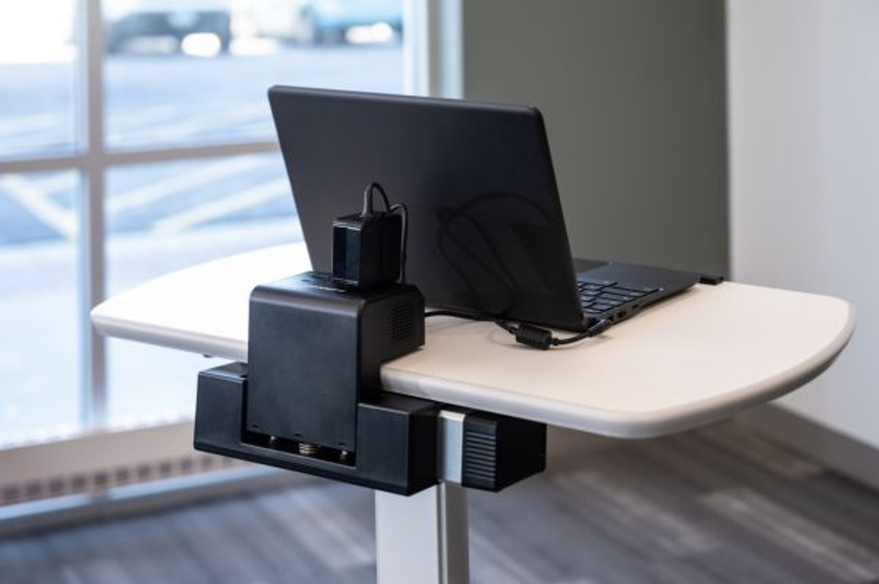 Pneumatic Height-Adjustable Lectern / Mobile Standing Desk with KwikBoost EdgePower® Charging Station (LX-PNADJ-EPW) in conference setting.