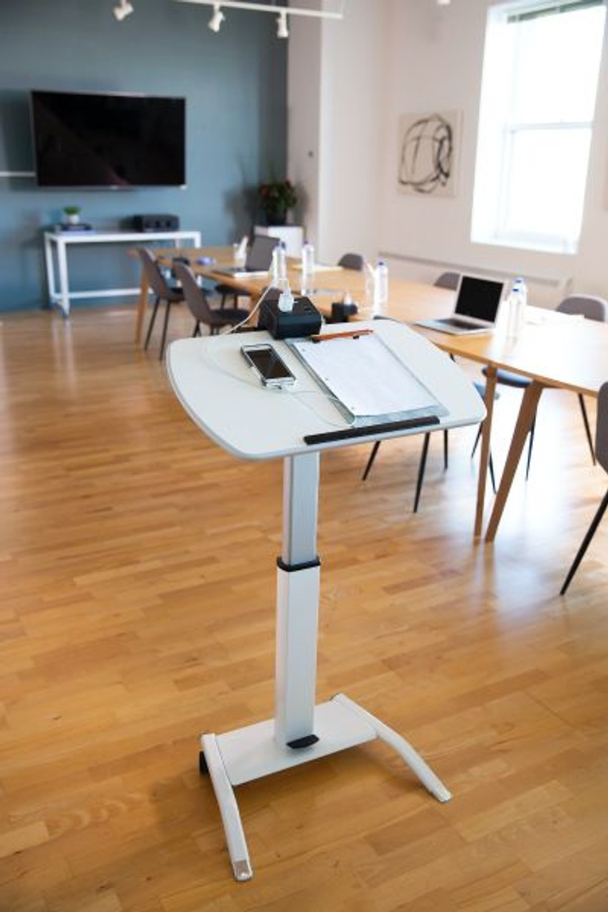 Pneumatic Height-Adjustable Lectern / Mobile Standing Desk with KwikBoost EdgePower® Charging Station (LX-PNADJ-EPW) in meeting scenario