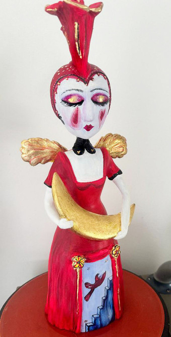 Red girl harlequin sculpture