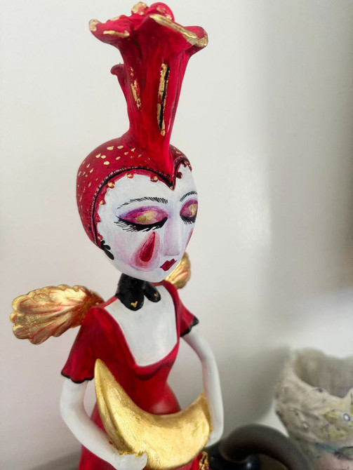 Red girl harlequin sculpture