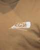 Front view of a person wearing the EGW Give'Em Thunder Turkey T-shirt, highlighting the feather logo on the chest.