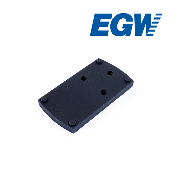 An angled top view of a black EGW dovetail adapter plate for mounting a Docter footprint red dot sight on a Sig P365, showing the top surface with four corner posts.