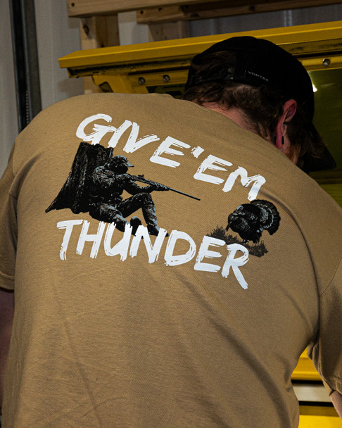 Rear view of a person wearing the EGW Give'Em Thunder Turkey graphic T-shirt, showcasing the full back design.