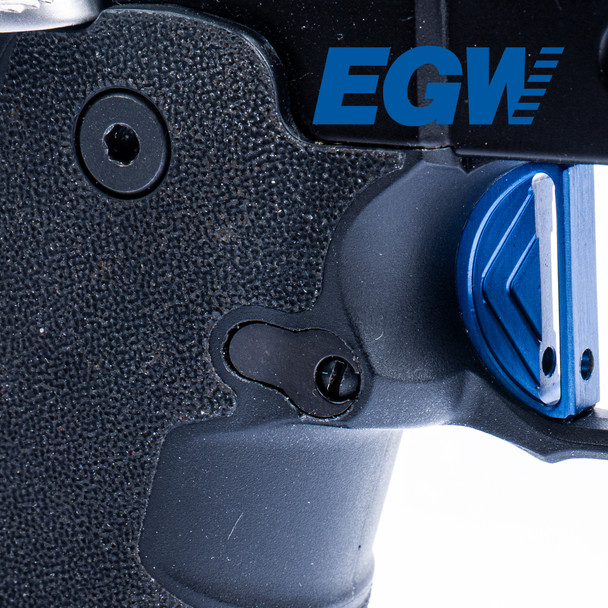 Right side close-up of the blue EGW magazine catch installed in a Springfield Prodigy, showing how its contour follows the factory frame curves.