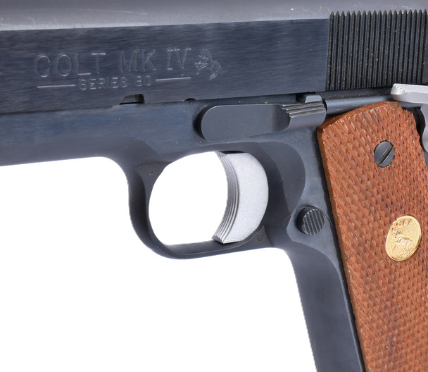 Right-side view of the 1911 Solid Prism Trigger – Medium installed in a 1911 pistol, showing the trigger fit within the frame.