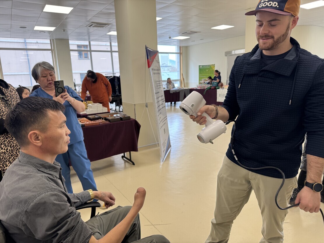 A technician uses Peel 3D’s portable scanner to 3D scan a person’s arm