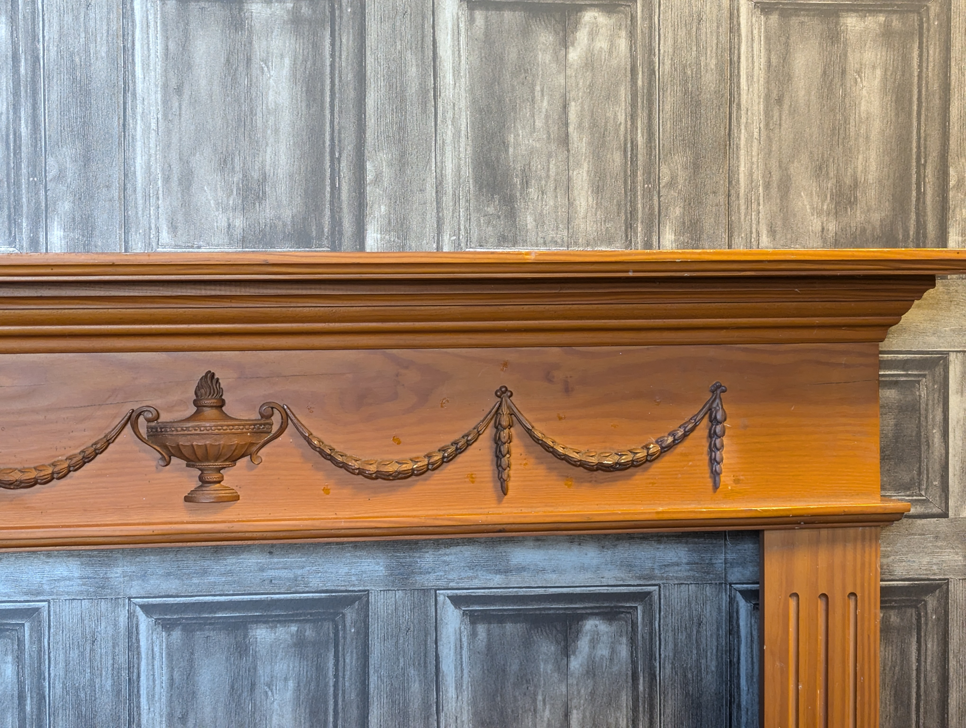 A close-up view of the repaired, 3D printed section of the antique fireplace