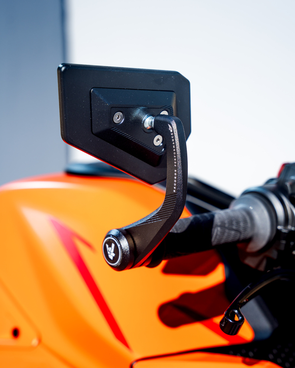 Close up of the mirror of an orange and black KTM 990 DUKE stunt motorcycle. 