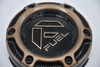 Close-up of the Fuel Off-Road logo on the FC873 Charger wheel center cap, part number 1004-79PBRZ.
