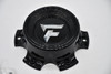 Close-up of the chrome Fittipaldi logo on black replacement wheel center cap FI-6H-01-SG(B).