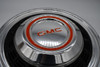 Used GMC Orange Logo Center Cap – Close-Up of Visible Surface Condition and Wear