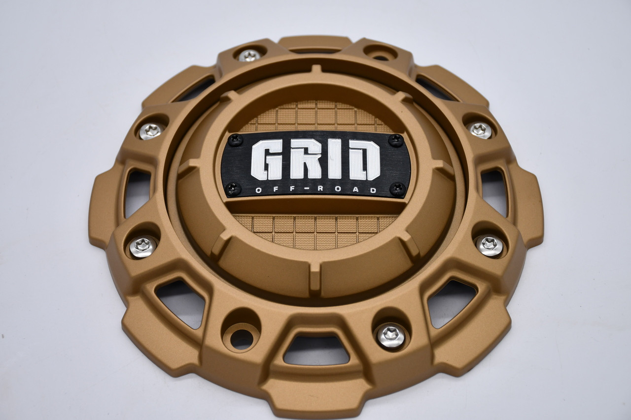 Replacement GRID Off-Road matte gold center cap GD-56-CAP for lifted trucks, Jeeps, and SUVs with custom gold off-road wheel setups and direct fit installation.