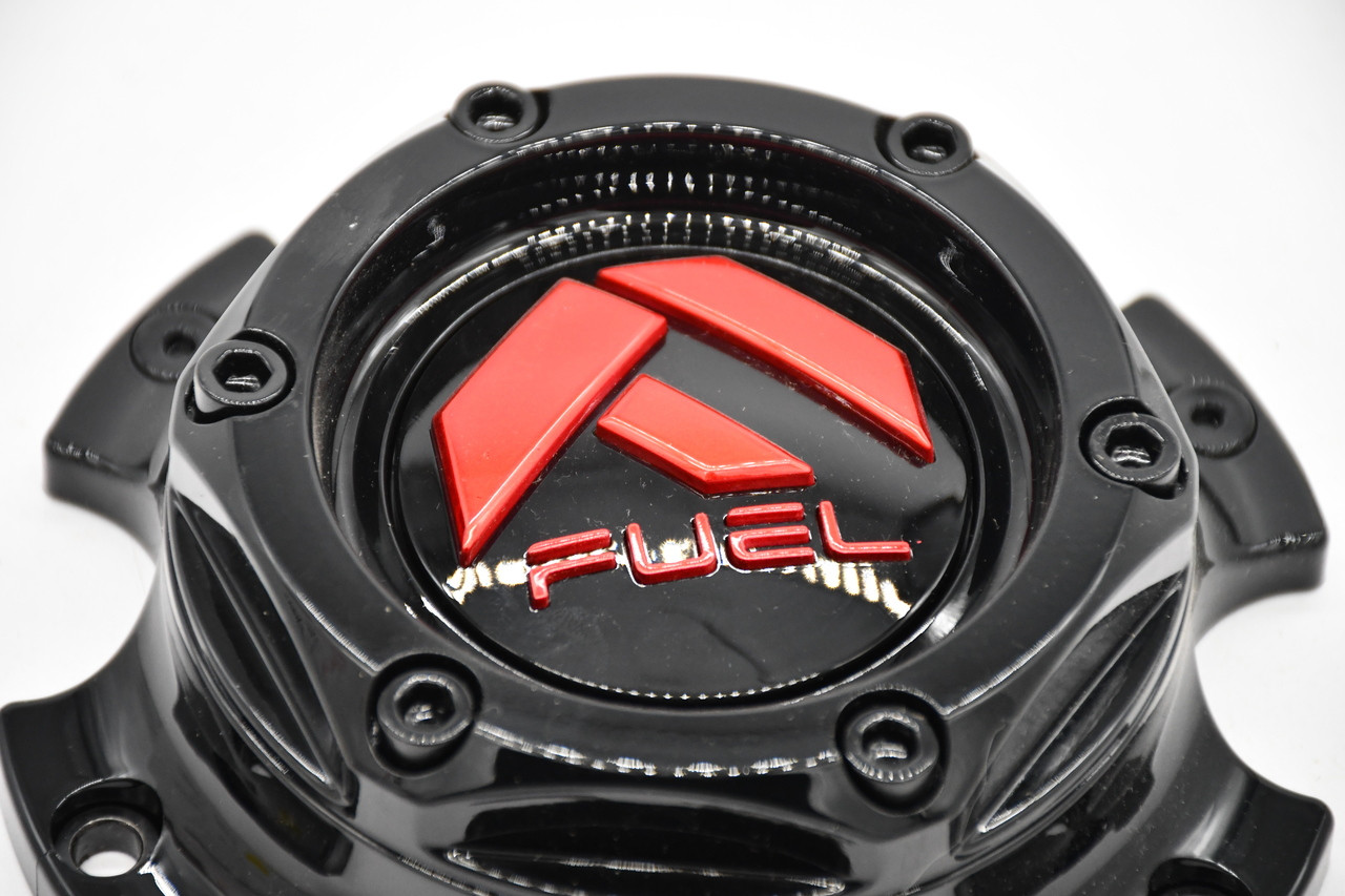 Close-up of the red Fuel Off-Road logo on the gloss black replacement wheel center cap 1004-37GBQ.