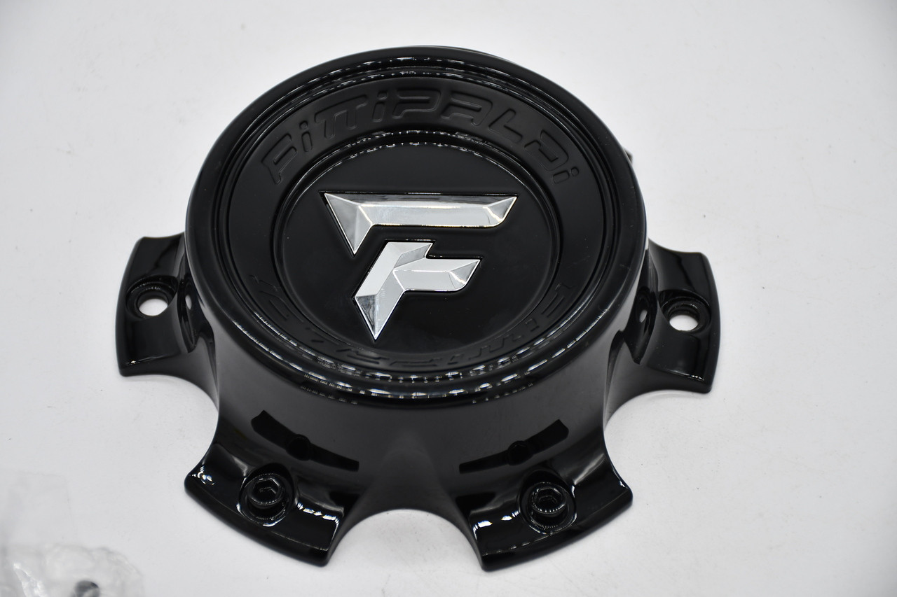 Close-up of the chrome Fittipaldi logo on black replacement wheel center cap FI-6H-01-SG(B).