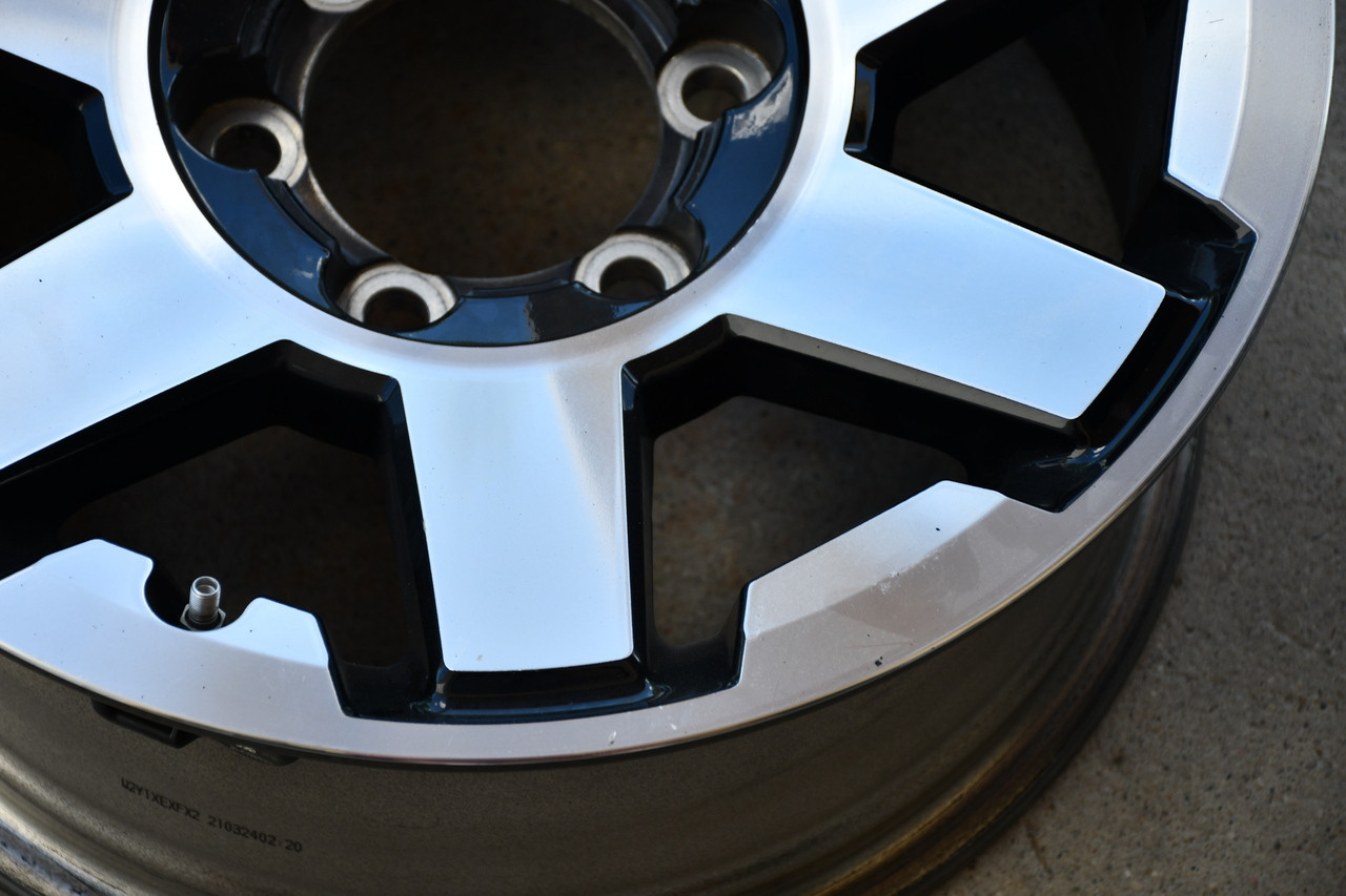 Genuine OEM Toyota 4Runner 17x7.5 machined alloy wheel featuring a 6x5.5 bolt pattern. Factory takeoff replacement rim designed to maintain factory fitment, appearance, and performance.