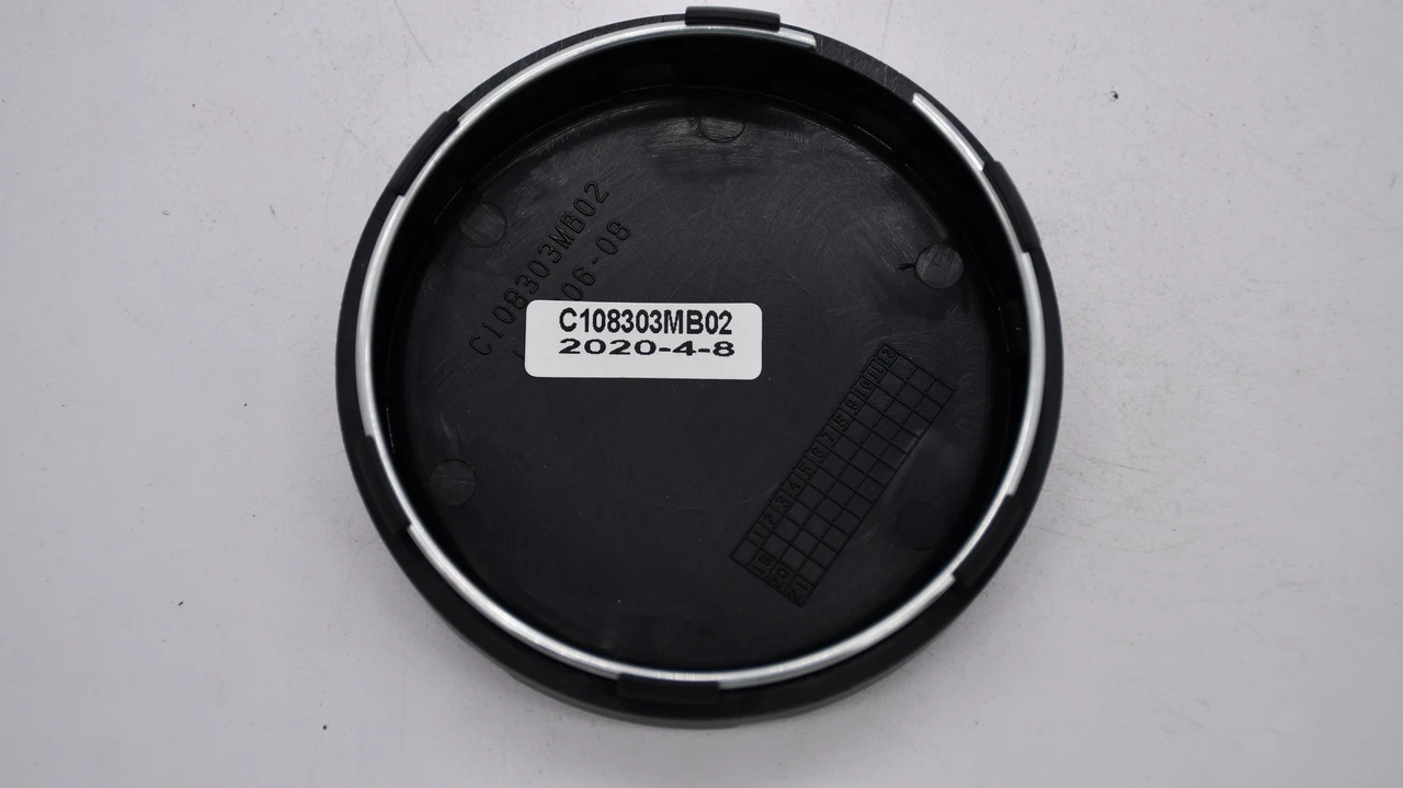 Back of Mayhem C108303MB02 center cap showing part number and attachment design