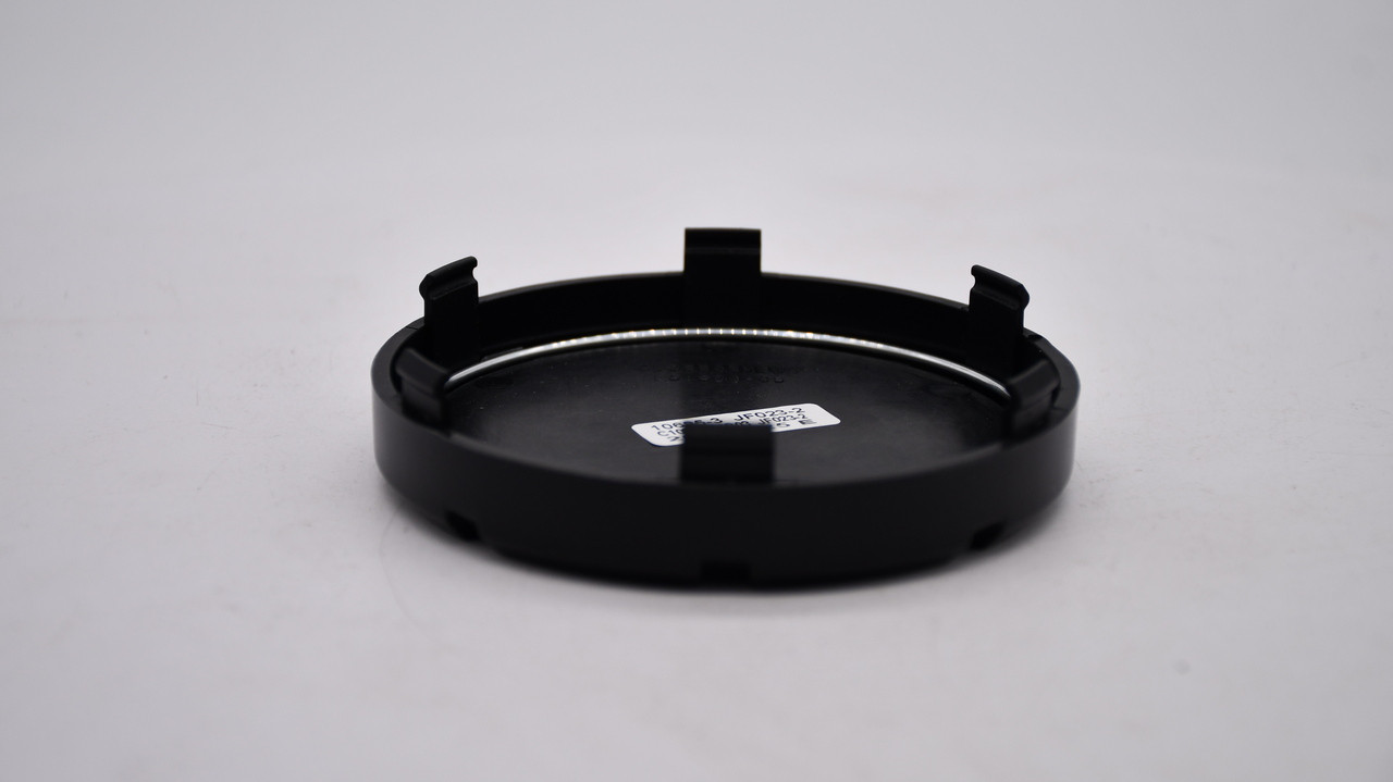 Rear of Mayhem C108303MB03 center cap showing part number and attachment features