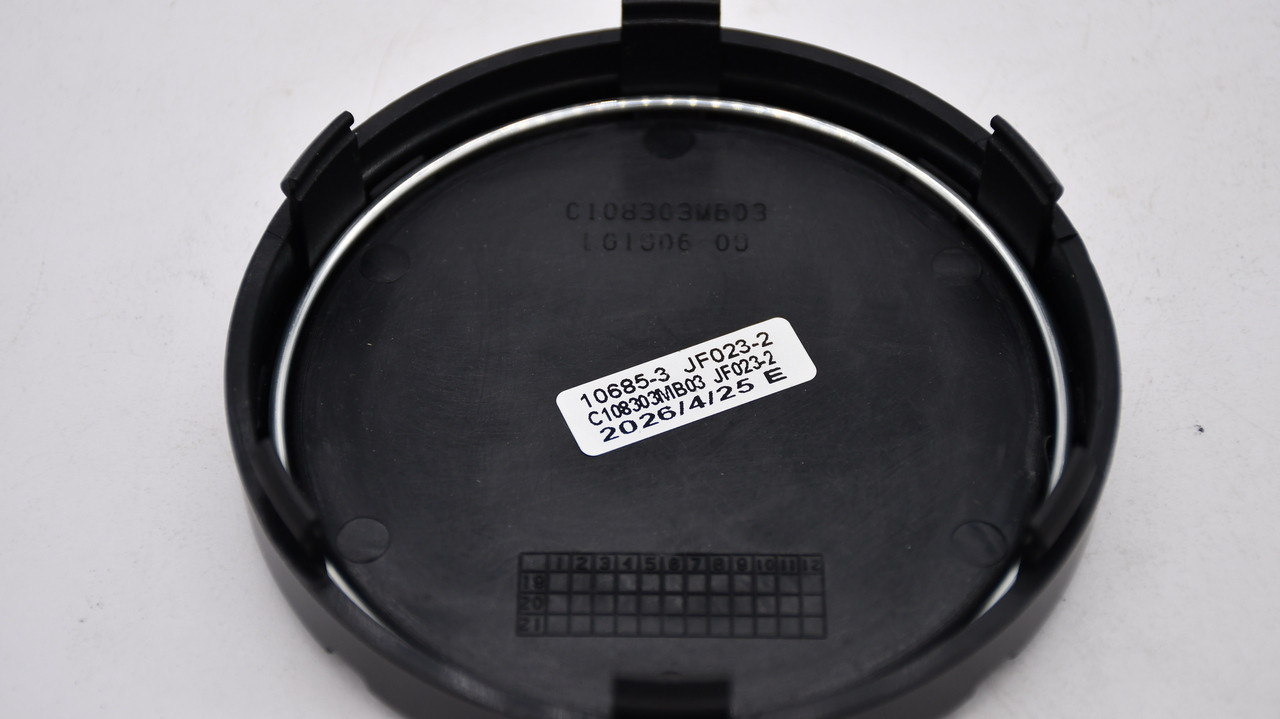 Rear of Mayhem C108303MB03 center cap showing part number and attachment features