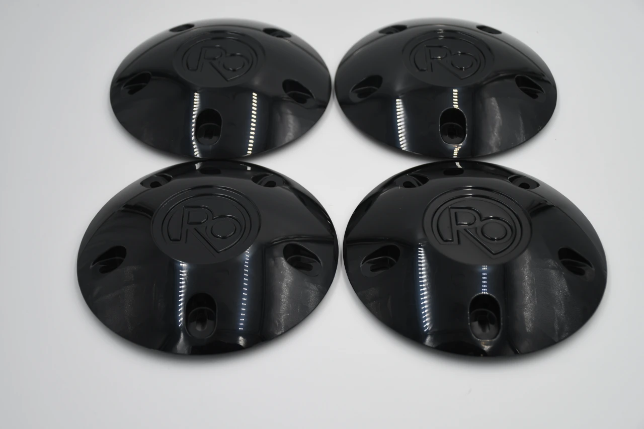 Black RO style hub caps set of 4 for classic Chevy Ford and Dodge vehicles with mounting hardware and aggressive blackout finish.