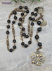 Vintage bronze chaplet with black onyx beads, featuring devotional Archangel Michael and St Benedict medallions, a treasured heirloom for Catholic prayer.