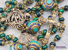 Unique antique-style heirloom rosary featuring solid bronze medals of Archangels Michael, Raphael, and Gabriel, with chrysocolla, turquoise, and lapis lazuli beads for Catholic prayer and devotion.