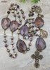 Unique antique-style large heirloom rosary with charoite and purple jasper beads, featuring solid bronze medals of Our Lady of Lourdes and the Crowned Mother Mary for Catholic prayer and devotion.