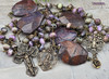 Unique antique-style large heirloom rosary with charoite and purple jasper beads, featuring solid bronze medals of Our Lady of Lourdes and the Crowned Mother Mary for Catholic prayer and devotion.