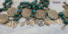 One-of-a-kind collector's edition antique-style grand Marian devotional heirloom rosary featuring Our Lady's life and apparitions with solid bronze medals of Annunciation, Assumption, Coronation, Virgin Mary, Miraculous Mary, Lourdes, Mother Mary, Immaculate Heart, Lady of Fatima, Lady of Medjugorje, Perpetual Help, Lady of the Rosary, Lady of the Pillar with Angels, Lady of Carmel, Sacred Heart of Jesus, and Holy Sacraments, crafted with chrysocolla, artisan turquoise, and red coral floral beads for Catholic prayer and devotion.