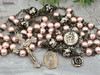Antique-style heirloom rosary featuring solid bronze medals of Our Lady of Carmel and the Sacred Heart of Jesus, crafted with peach pearl shell and floral Tensha beads for Catholic devotion and prayer.