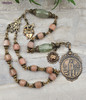 One-of-a-kind antique-style devotional chaplet featuring solid bronze medals of Fatima, Sacred Heart of Jesus, and Immaculate Heart of Mary, crafted with peach moonstone and green strawberry quartz prayer beads for Catholic meditation and reflection.
