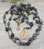 Deepen your devotion to St. Joseph with this exquisite heirloom-quality bronze chaplet featuring St. Joseph with Guardian Angel, Holy Spirit medals, and sodalite and lapis lazuli beads.