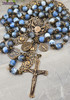 Ornate antique-style heirloom rosary with bronze medals of Our Lady of Lourdes, Miraculous Mary, Archangel Raphael, Guardian Angel, and St. Jude, crafted with blue agate beads.