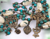 ⚜ Handcrafted Conch Turquoise Inlay Beads with their artisan craftsmanship and intricate inlay work represent the beauty of doing small things with great love as Therese taught and call to mind the solid foundation of faith represented by Mary's pillar
This devotional rosary connects us to the ancient foundation of Marian devotion united with the Little Way's simple trust and the Sacred Heart's infinite love. A perfect gift for those of Spanish heritage, devotees of Our Lady of the Pillar, souls drawn to St Therese's Little Way, lovers of the Sacred Heart, October 12th Pillar feast and October 1st Therese feast, collectors of handcrafted artisan bead rosaries, or hearts drawn to the powerful combination of Mary's foundational apparition, Therese's simple spirituality, and Christ's merciful heart.