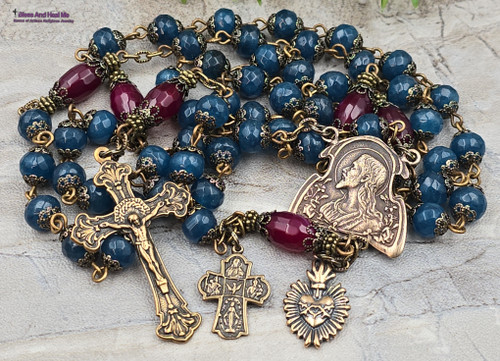 Vintage bronze rosary with blue jade and red agate prayer beads, featuring a Jesus Sacred Heart medallion, perfect for Catholic devotion and meditation.