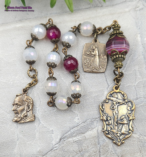 One-of-a-kind antique-style chaplet with solid bronze medals of Padre Pio and St Francis, crafted with elegant white and vibrant red agate beads