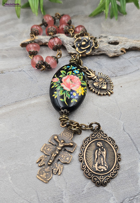 Antique-style heirloom chaplet with solid bronze Our Lady of Guadalupe medal, Sacred Heart of Jesus medal, Caravaca Crucifix, rose medals, watermelon quartz beads, and a floral Tensha bead