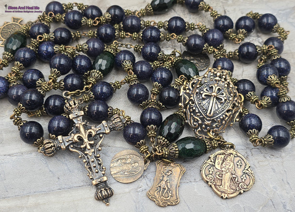 Here's a concise and descriptive image alt text line that incorporates relevant keywords for better Google SEO:

Vintage bronze rosary with 12mm blue sandstone beads, featuring Joan of Arc, St Michael, and St Raphael medallions, perfect for Catholic prayer and devotion.