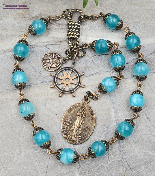 Antique-style nautical Star of the Sea mariners devotional chaplet with solid bronze Stella Maris and Guardian Angel medals, helm wheel charm, knot center, and blue jade beads