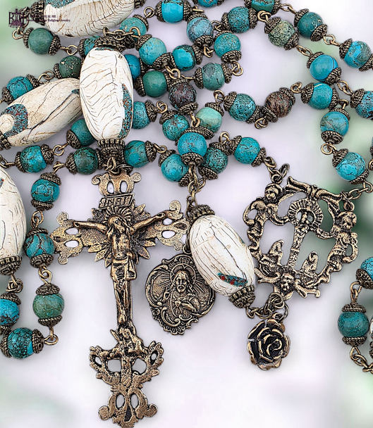 ⚜ Handcrafted Conch Turquoise Inlay Beads with their artisan craftsmanship and intricate inlay work represent the beauty of doing small things with great love as Therese taught and call to mind the solid foundation of faith represented by Mary's pillar
This devotional rosary connects us to the ancient foundation of Marian devotion united with the Little Way's simple trust and the Sacred Heart's infinite love. A perfect gift for those of Spanish heritage, devotees of Our Lady of the Pillar, souls drawn to St Therese's Little Way, lovers of the Sacred Heart, October 12th Pillar feast and October 1st Therese feast, collectors of handcrafted artisan bead rosaries, or hearts drawn to the powerful combination of Mary's foundational apparition, Therese's simple spirituality, and Christ's merciful heart.