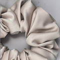 Tuhil Threads Large Mink Royal Micro Satin Scrunchie. Luxurious large satin hair tie for a gentle, stylish hold. Shop Tuhil Threads hair accessories.