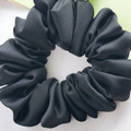 Tuhil Threads Medium Black Royal Micro Satin Scrunchie. Luxurious medium satin hair tie for a gentle, stylish hold. Shop Tuhil Threads hair accessories.