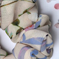 Tuhil Threads Large Floral Print Scrunchie. Charming large hair tie with a beautiful multi-colour floral design, offering a stylish and gentle hold. Shop Tuhil Threads hair accessories.