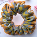 Tuhil Threads Medium Retro Daisy Print Polycotton Scrunchie. Shop Tuhil Threads hair accessories.