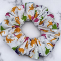 Tuhil Threads Medium White & Rainbow Dinosaur Print Polycotton Scrunchie.Shop Tuhil Threads hair accessories.