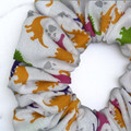 Tuhil Threads Medium White & Rainbow Dinosaur Print Polycotton Scrunchie.Shop Tuhil Threads hair accessories.